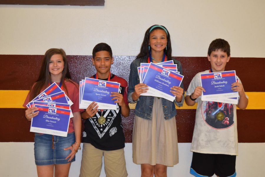 Seventh graders Ellie Grissett, Spain Covert, McKinna Brackens, and Jake Schick receive awards for their hard work. Photo contributed by Tammy Gawryszewski.