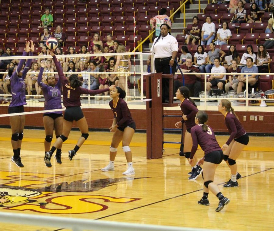 Junior Kayelee Adams tips the ball as senior Aaryn Scires, freshman Jennifer Pina, junior Rebecca Dunlap, and senior Ashlyn Partain anticipate the play. Photo by Jashaughn Hatcher.