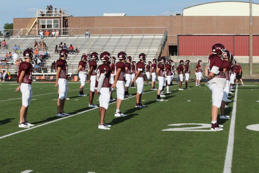 The Varsity football team lines up to begin warm-ups at the scrimmage against Teague on August 17. Photo by Morgan Coleman.