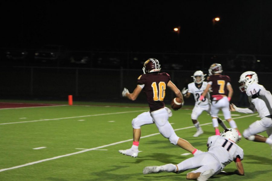 Senior Blake Posey breaks from a tackle attempt by Madisonville and scores at the Pink-Out game Oct. 5 at Eagle Field.
