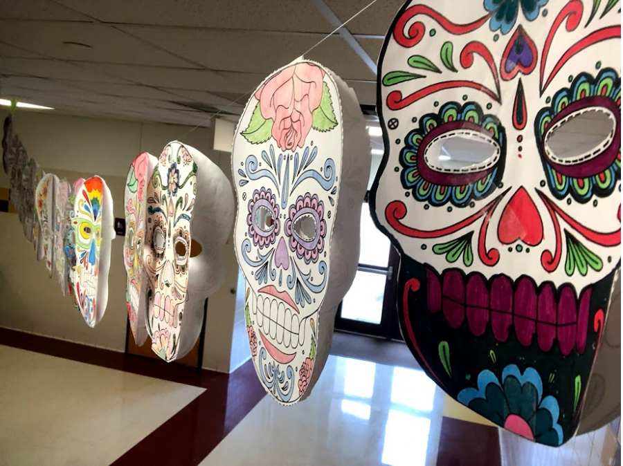 Student-created+Day+of+the+Dead+masks+hang+in+the+T-wing+hallway.