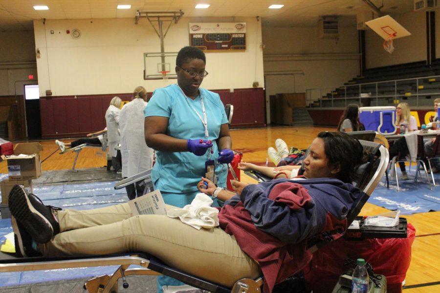 Senior Cristal Reyes  donates  blood. Photo by Trista Thornbrough