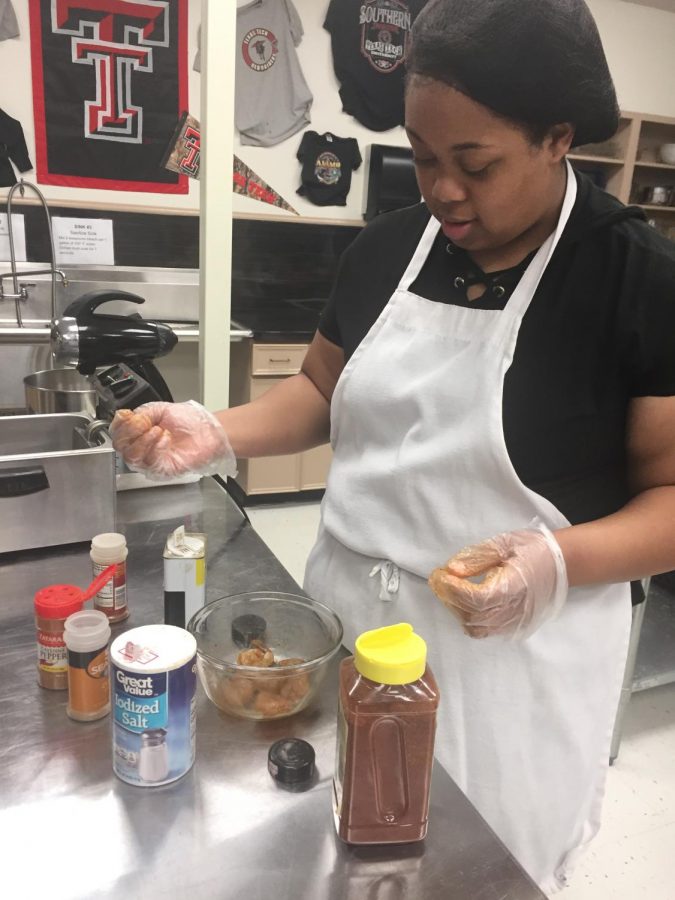 Junior Gerlicia Manning prepares shrimp for competition. Photo contributed by Laura Tugwell.