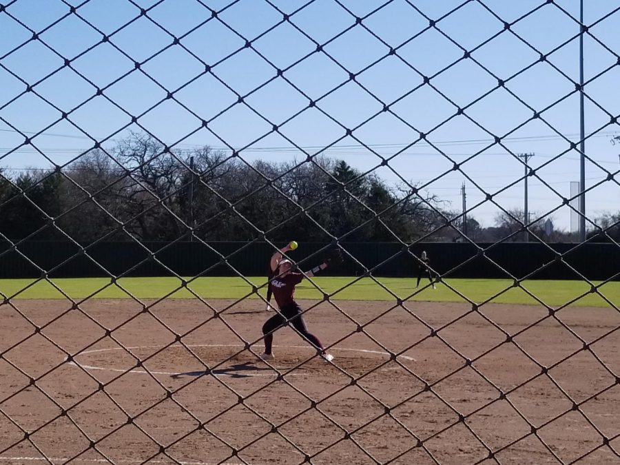 Senior Rebecca Dunlap pitches the ball. Photo contributed by Kathie Maciel.