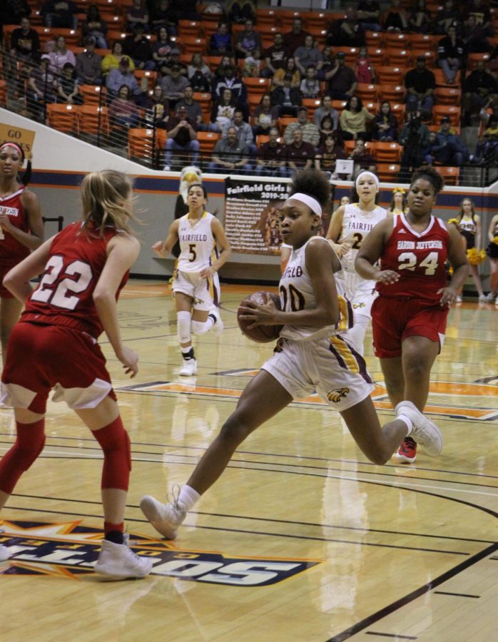 Freshman Shadasia Brackens dribbles to score at the regional game Hardin Jefferson. Photo contributed by Mary Awalt.