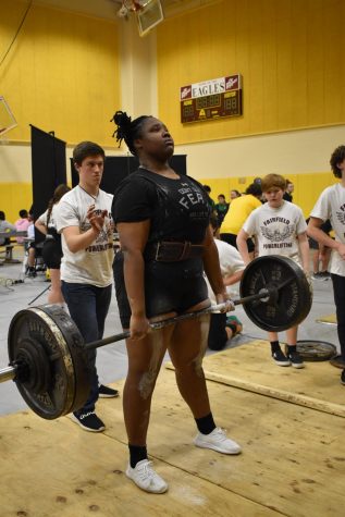 Destiny Dowell lifts for a total of 980 in qualifier meet.