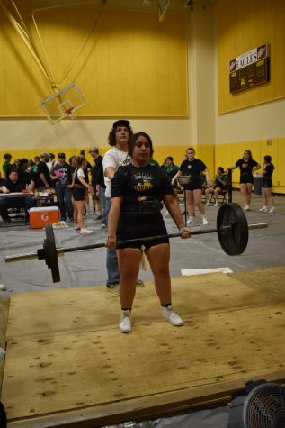 Donna Munoz dead lifts to qualify for state.