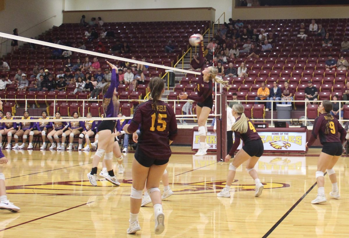 Senior Avery Thaler spikes the ball over the net against Buffalo. The Lady Eagles won in three sets.