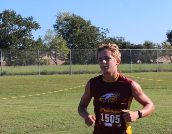 Sophomore Collin Loviette crosses the finish line in second place at the Golden Eagle Run in Fairfield