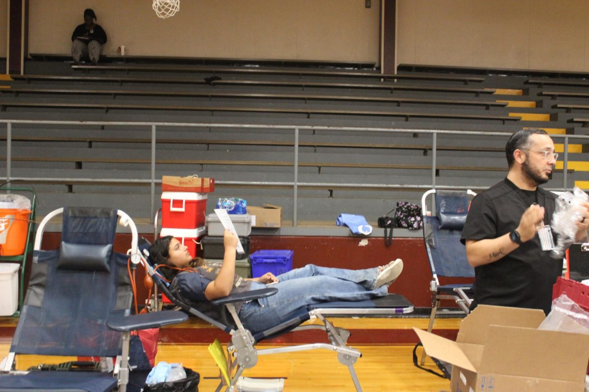 Senior Gabariella Irteimeh donates blood at the drive on October 2.